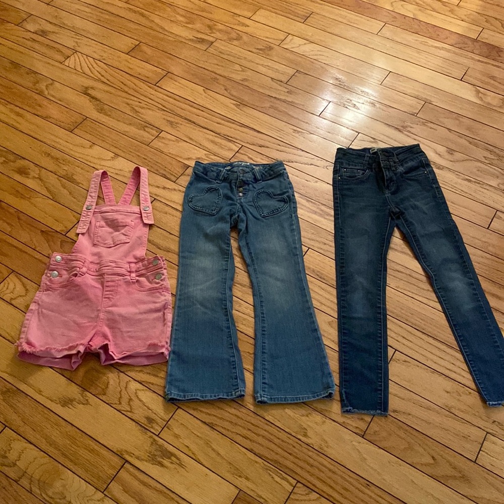Bundle of two pairs of  jeans and one overall.
